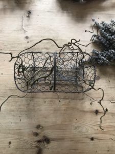 ariel view of wire basket, twisted hazel and lavender used for flower art