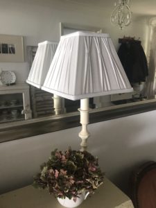 candlestick lamp with grey shade, mirror and hydrangea creates home lighting ideas