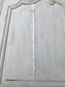 cracks on primed rustic armoire door filled 