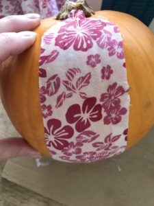 autumn craft - covering an orange pumpkin with pink floral fabric