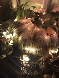 silver pumpkin lights and seasonal decor create autumn decor arrangement