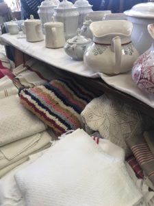 vintage textiles and jugs at winter fair