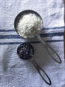 rice, lavender, measuring spoons and grainsack for making scented rice bags