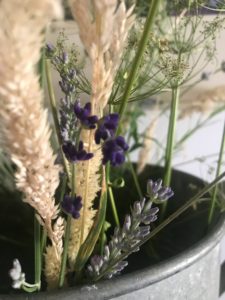 various dried flowers used for dried flower crafts in zinc bucket