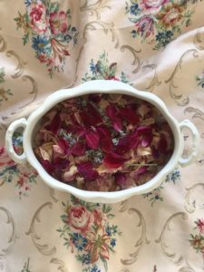 dried rose petal pot pourri in tureen on vintage fabric - dried flower crafts