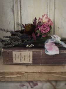 dried flower craft posy on french books with vintage ribbon