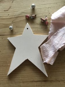 making a handmade pink wooden christmas decoration