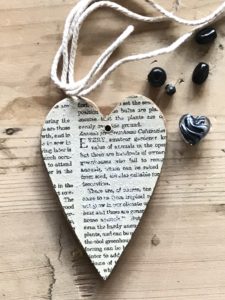 book page covered heart and trimmings make homemade tree decorations