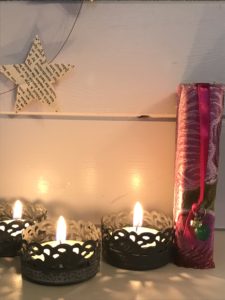 tea lights, paper stars and decorative matchboxes