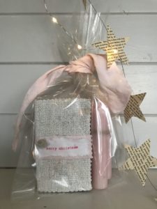 pretty matchboxes and candles in clear bag with pink ribbon and paper stars