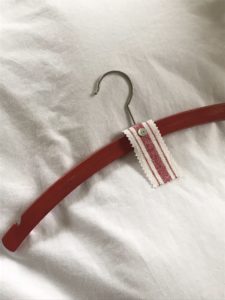 red decorative wooden hangers