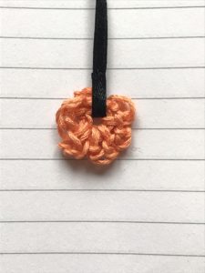 orange crotched book mark in fabric covered notebook