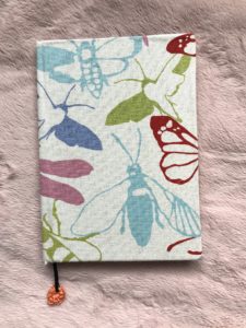 how to cover a notebook with fabric - pretty linen with moths