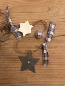 zinc star, blue fabric and button and clay christmas decoration star