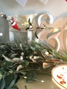 White Ampersand and letter H with hanging clay decorations for Christmas andfaux mistletoe and candle