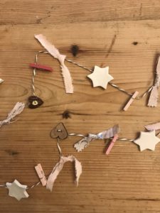 clay decorations for christmas with ribbon, heart buttons and pink pegs