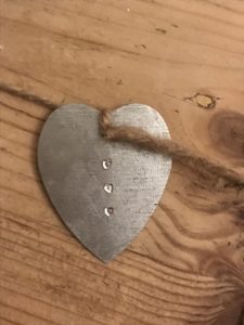 zinc heart with crystal embellishments and string