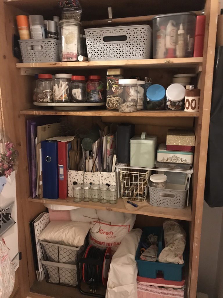 Inside an organised and tidy craft cupboard