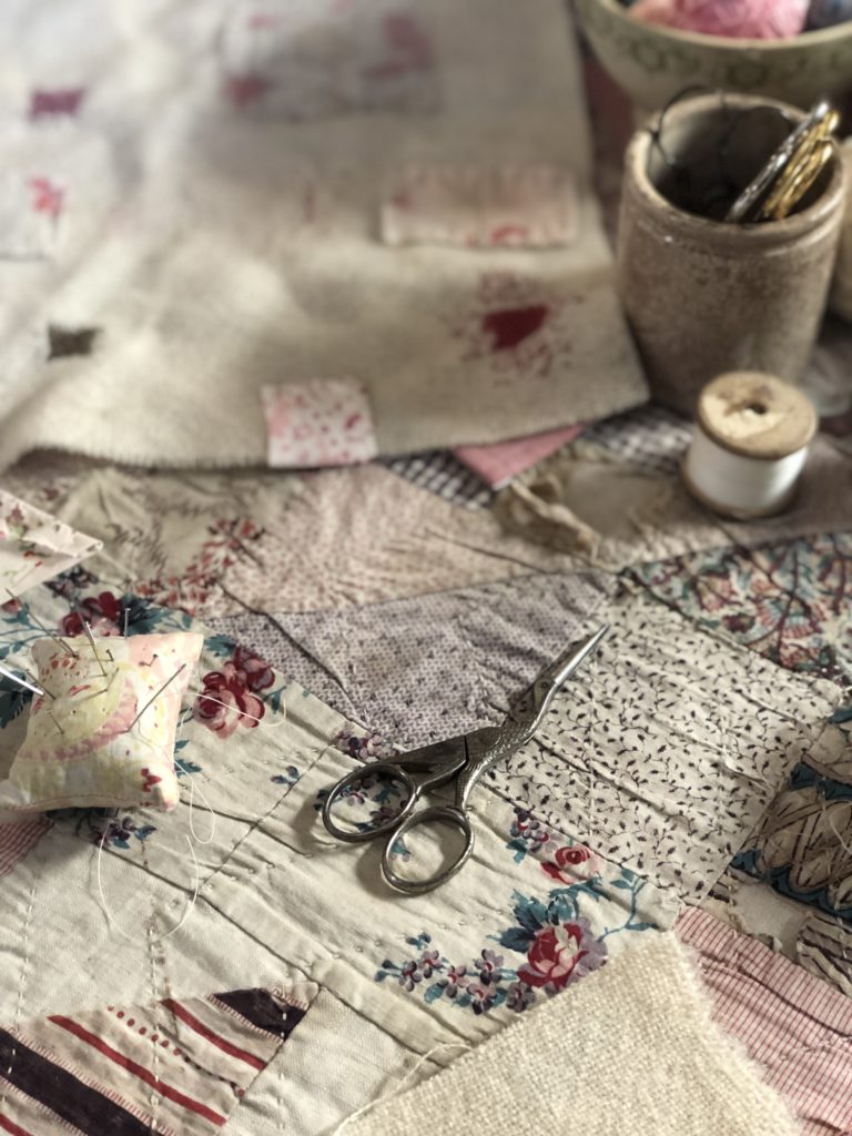 how to darn a hole using vintage scissors, fabrics and threads