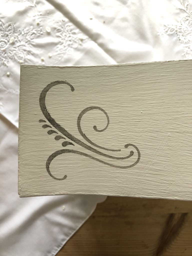 scroll stencil applied to painted drawer