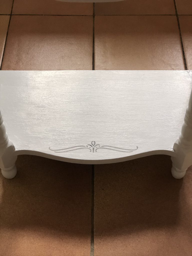 stencil scroll applied to painted shelf