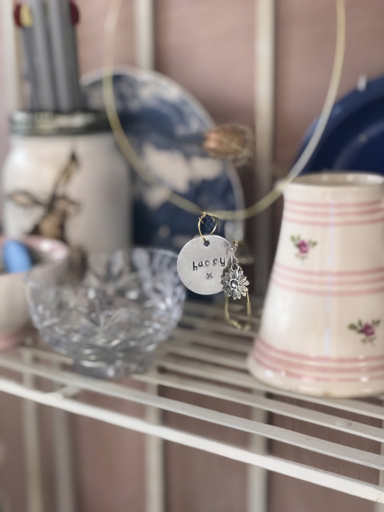 Metal Stamping - metal happy decoration with wire shelf, glass bowl and potter jug