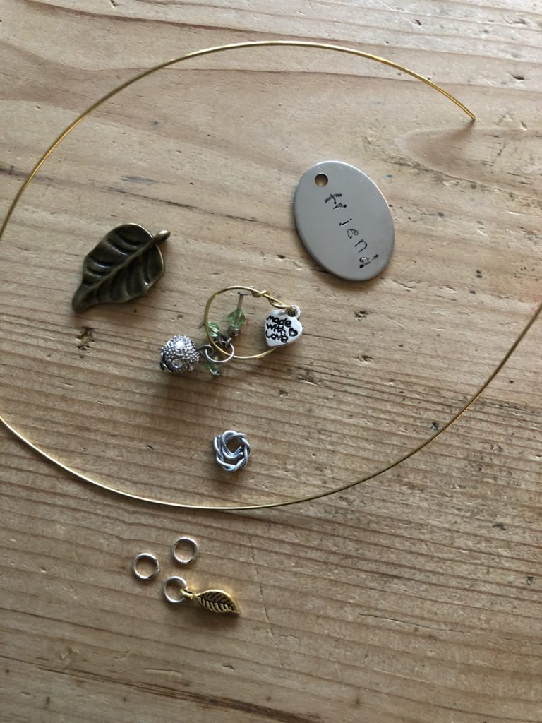 Making a hanging decoration using metal tag and trinkets