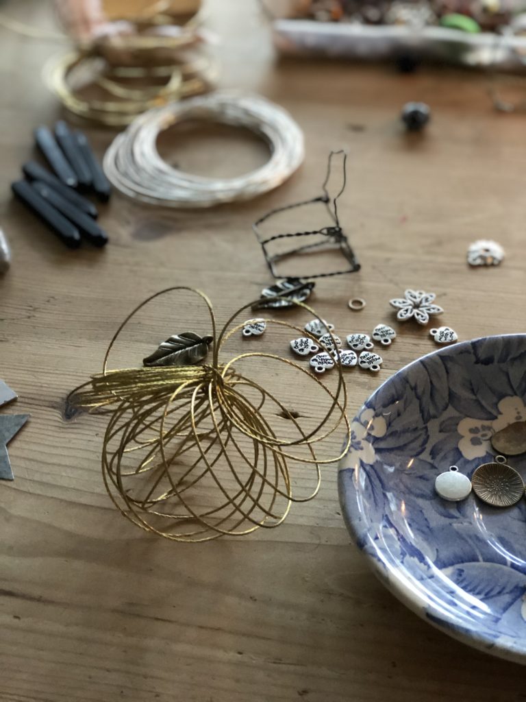 Wires and trinkets used to make metal hanging decoration