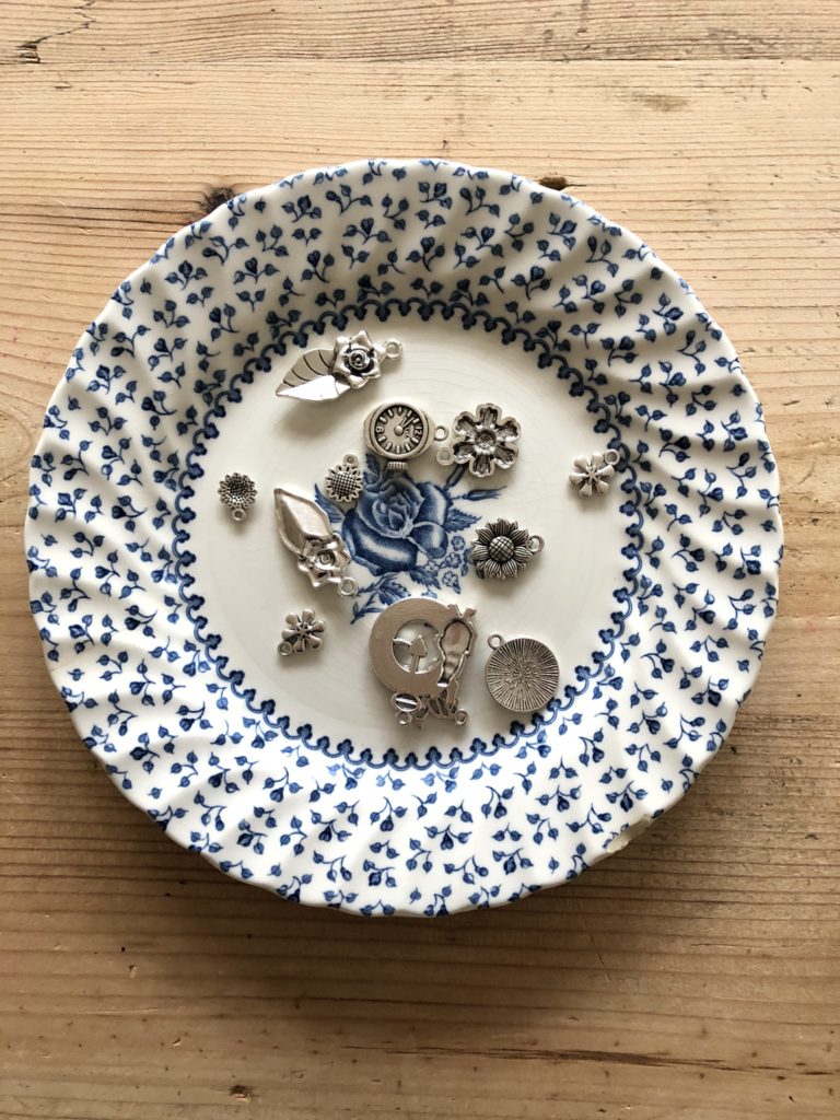 flatlay of trinkets on blue plate