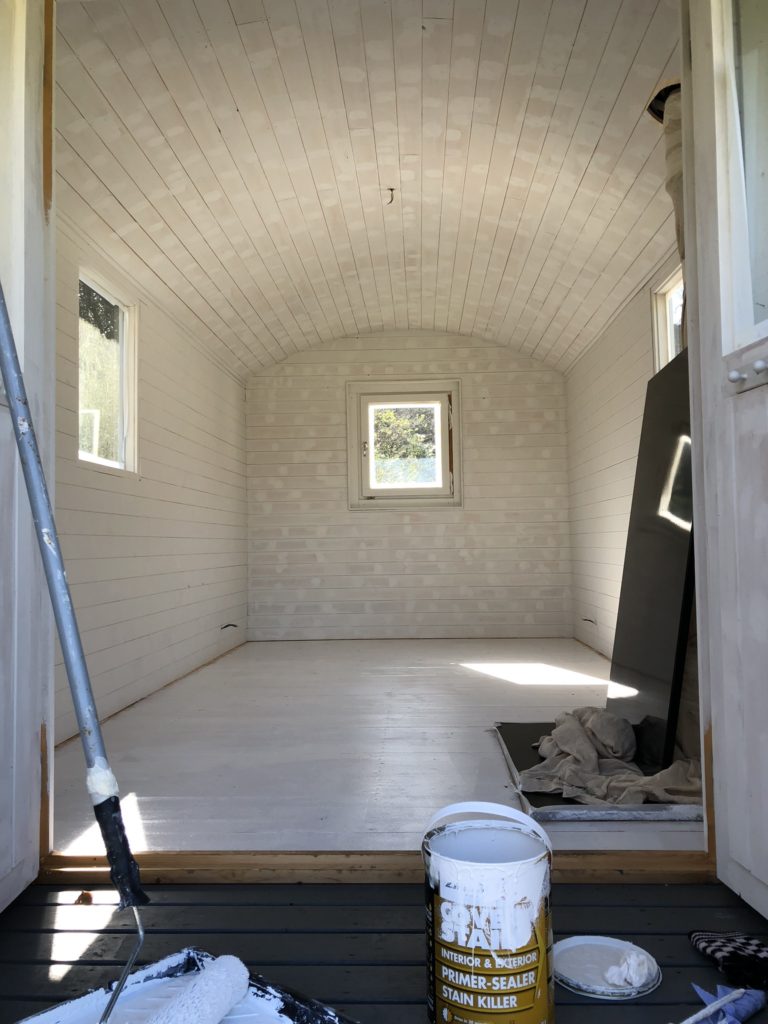 painting the interior of a shepherd's hut white