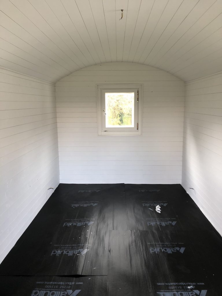 painting the interior of a shepherd's hut white