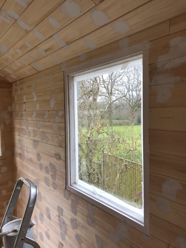 masking the windows of a shepherds hut 