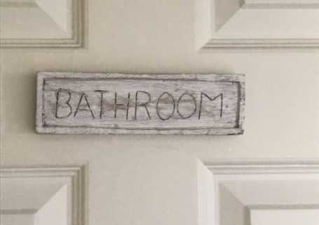 Bathroom sign used in bathroom refresh