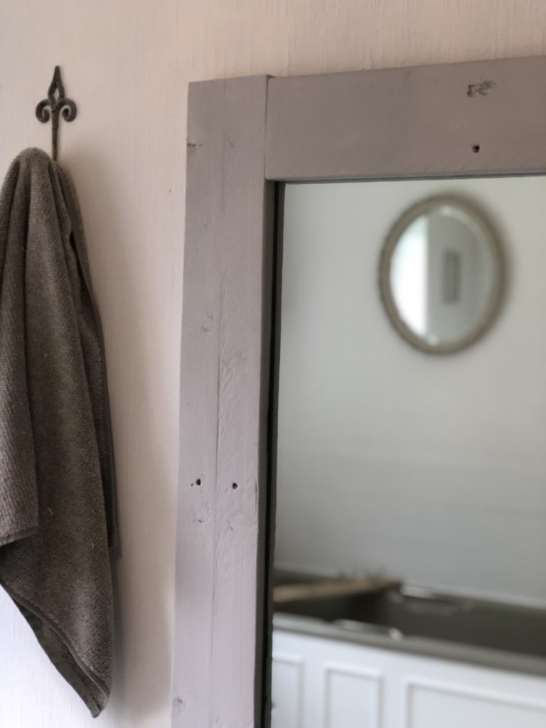 reflection of towels in mirror in bathroom refresh