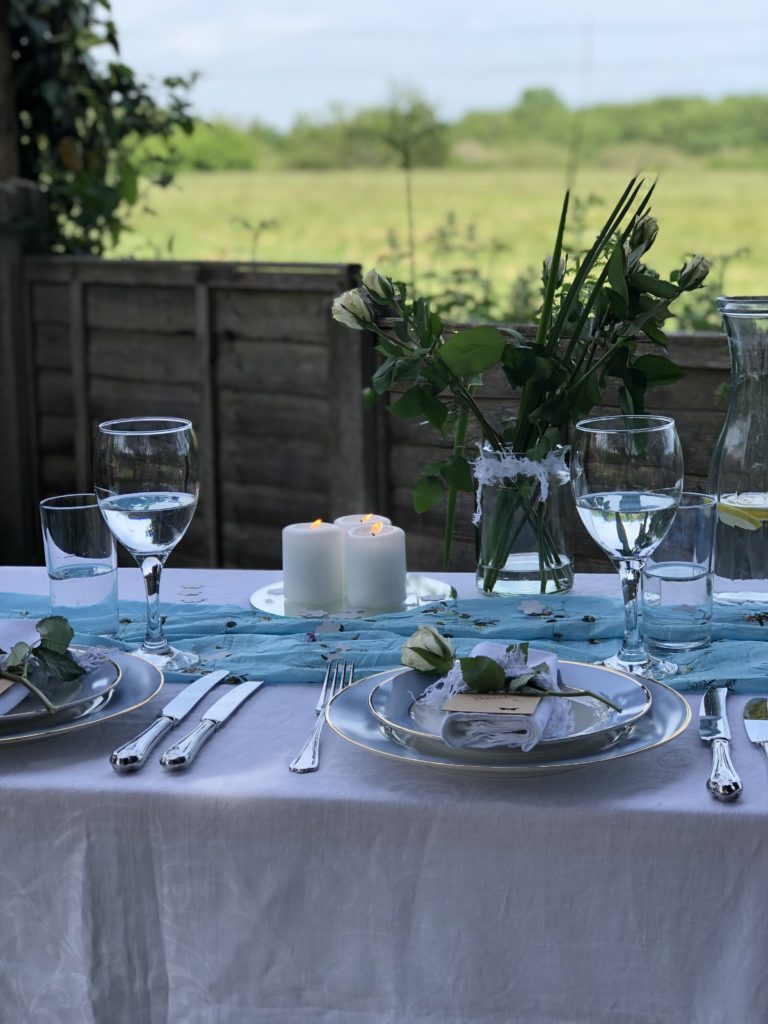 Summer alfresco dining overlooking green fields