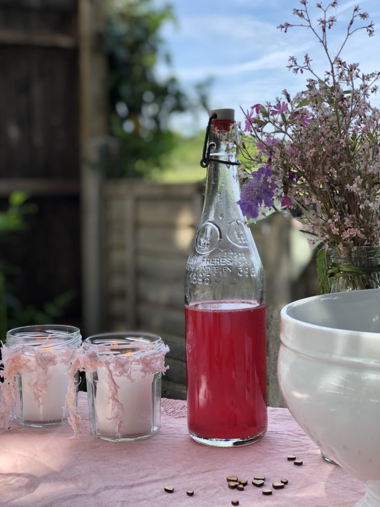 old fashioned pop bottle with candles used for simple table decoration