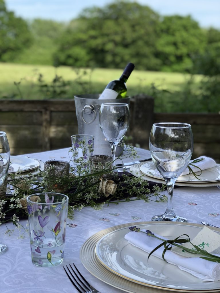 outdoor dining table with view of fields behind