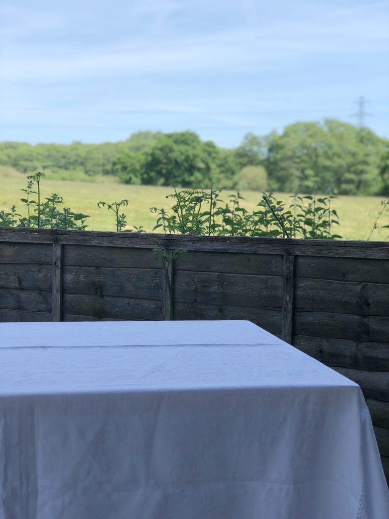 white table cloth in garden setting 