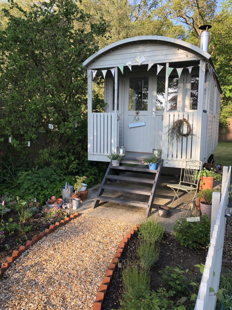 Shepherd's hut and gravel path