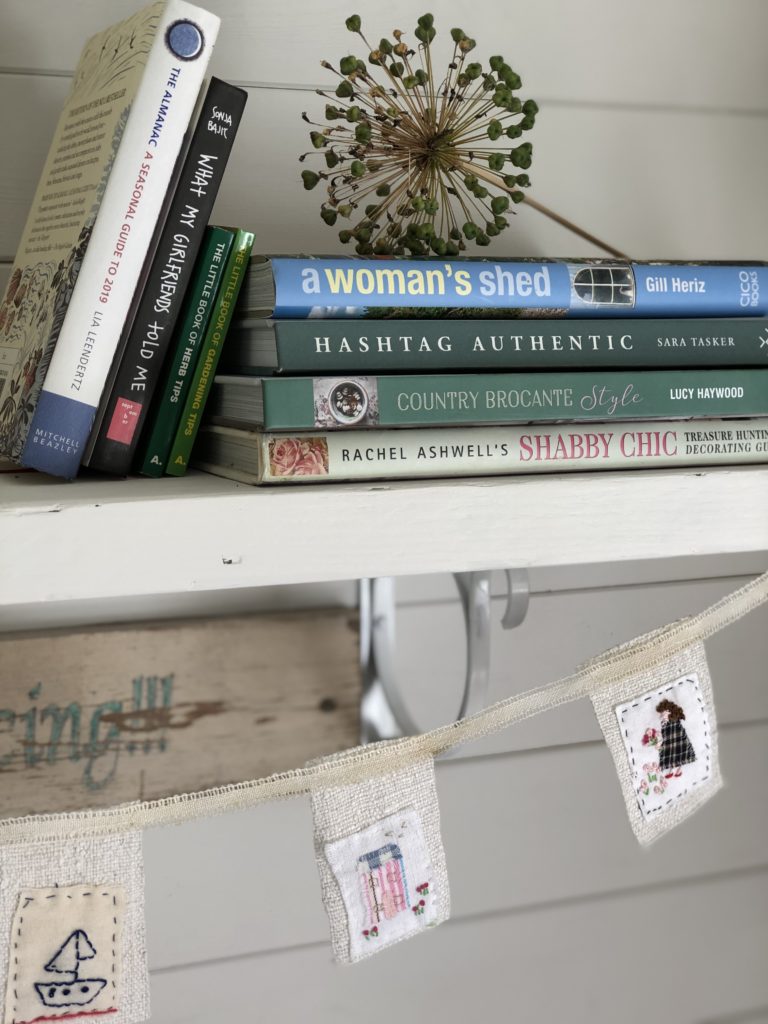 mini fabric bunting dresses painted shelf with beautiful ornaments and decoration