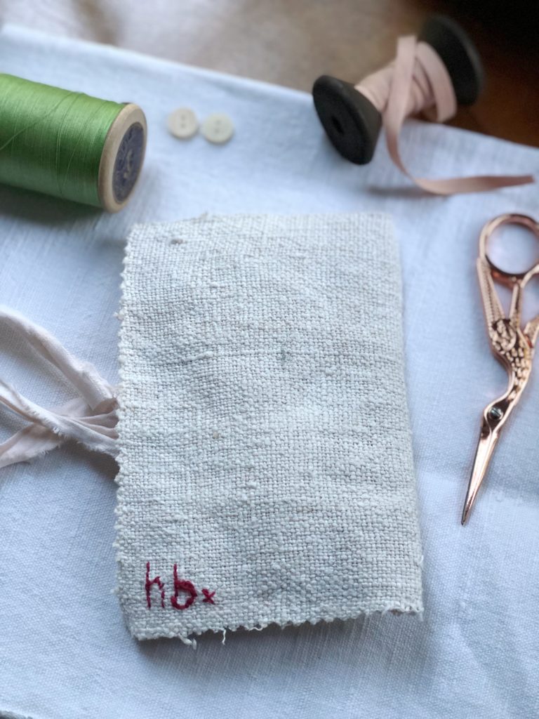 Back cover of pretty hand stitched needle case with embroidery initials