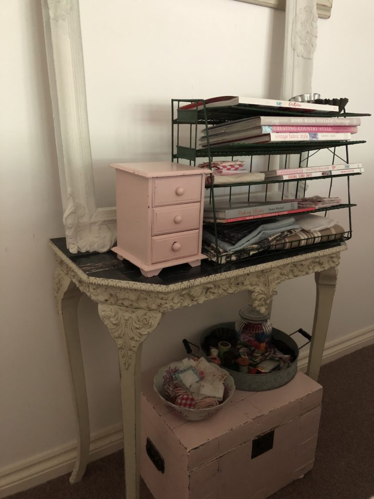 pretty sewing nook with pink drawers and box