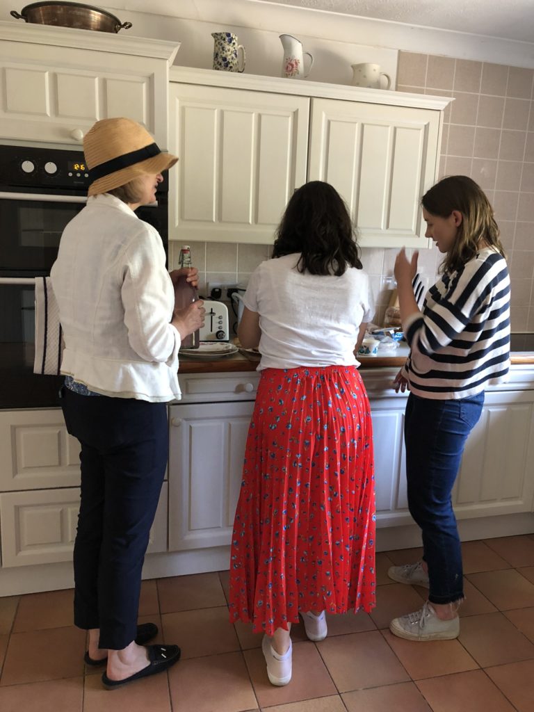 three ladies in a kitchen