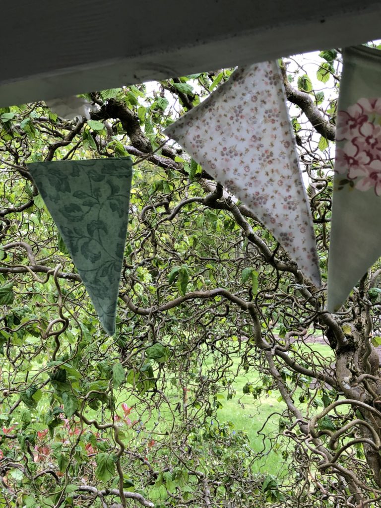 fabric bunting blowing in the garden breeze