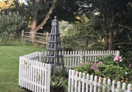 wooden obelisk in cottage garden