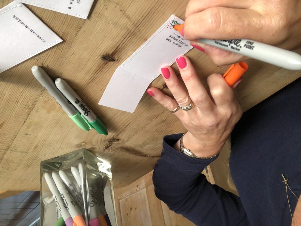 decorating a diy seed envelope packet with sharpies