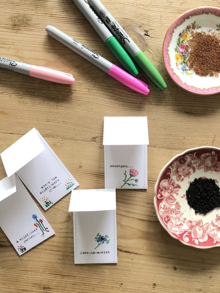 decorating a diy seed envelope packet with sharpies