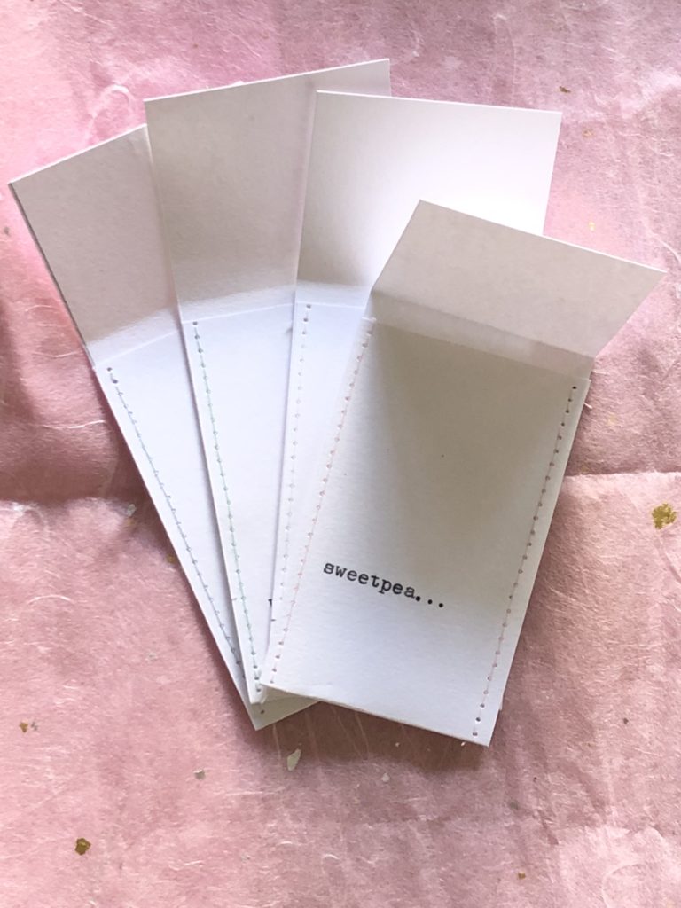 making assorted white diy seed envelopes 