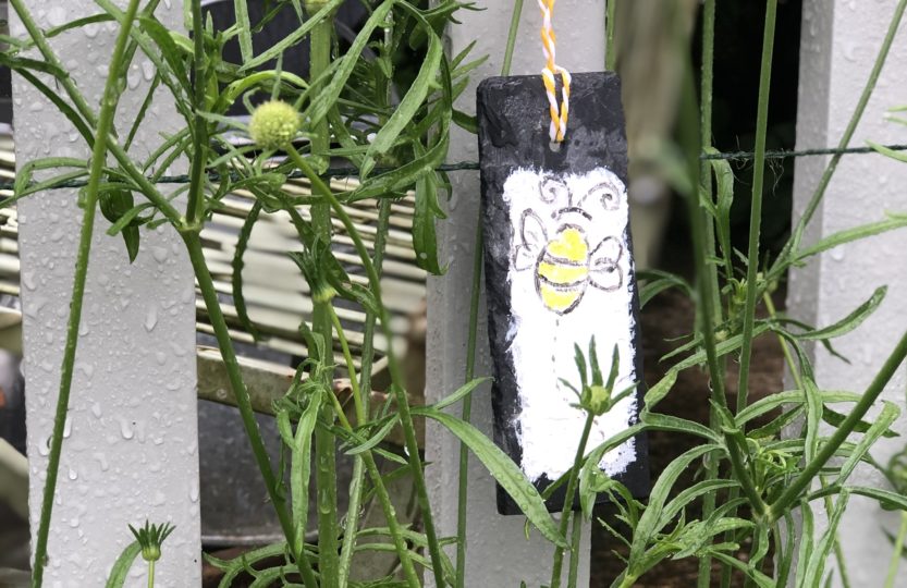 bee design on a slate plant maker