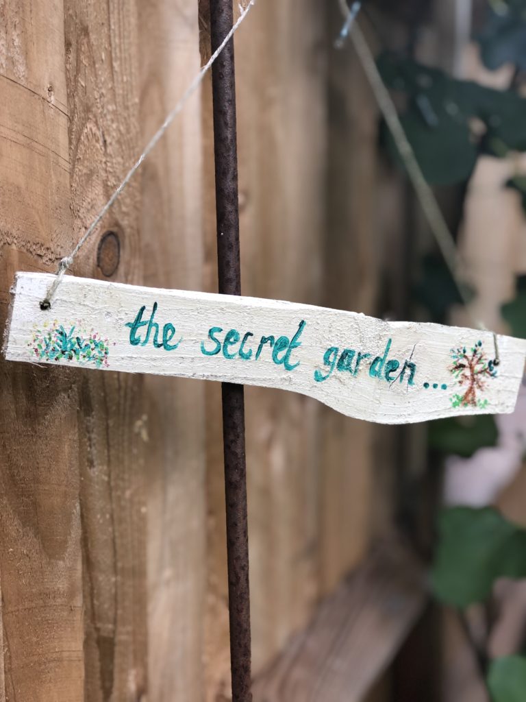 the secret garden hand painted wooden sign